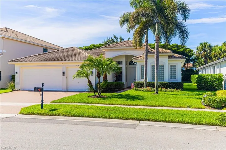 Mediterranean / spanish-style home with a front lawn