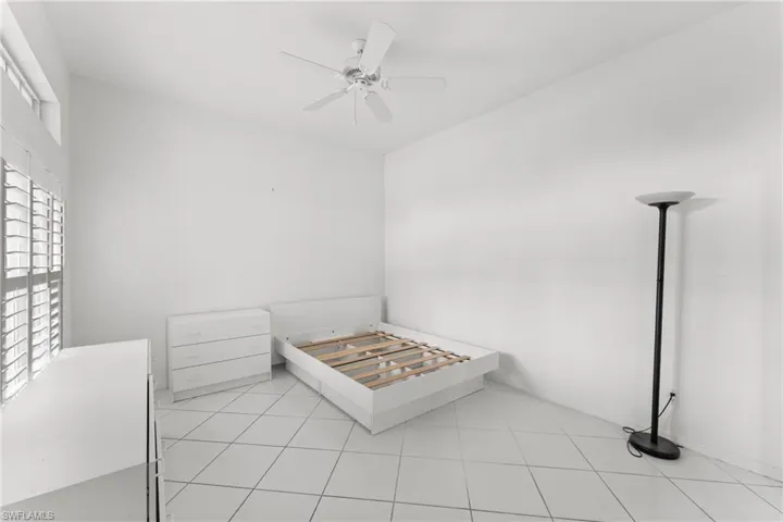 Unfurnished bedroom featuring a ceiling fan