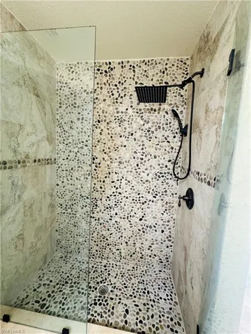 Bathroom with a tile shower