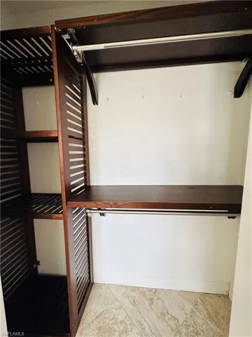 Walk in closet featuring light tile patterned floors