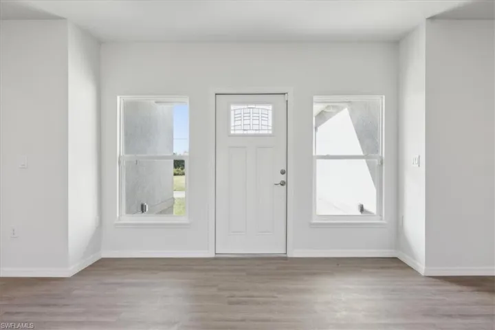 Entryway with light hardwood / wood-style flooring