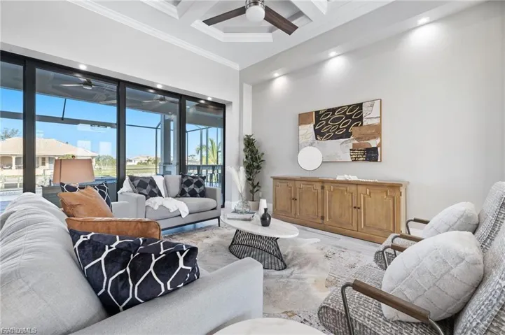 Living area overlooks lanai & pool
