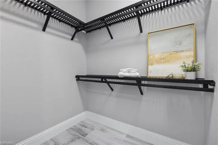 Primary bedroom closet 1
