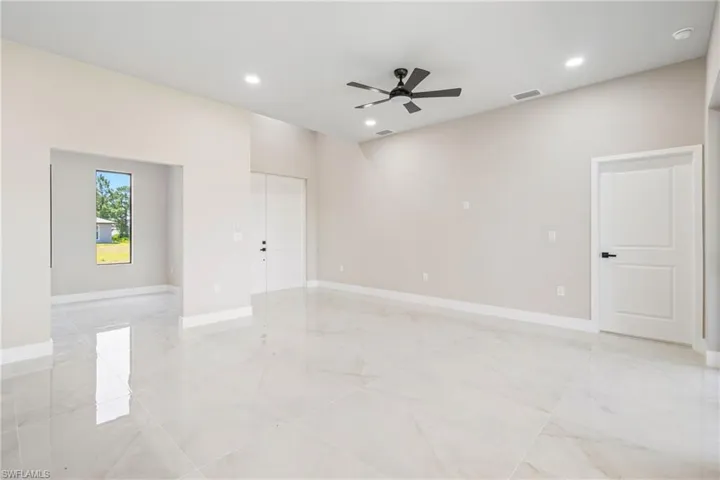 Unfurnished room featuring recessed lighting, ceiling fan, and light marble finish floors