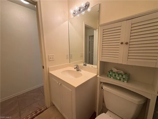 Bathroom with vanity and tile patterned flooring