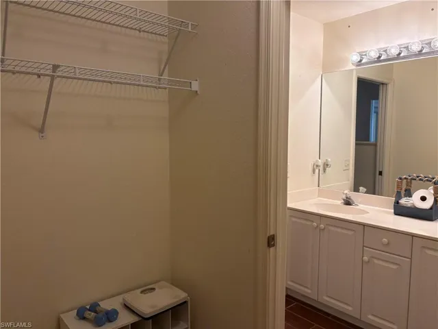 Bathroom with vanity and wood finished floors