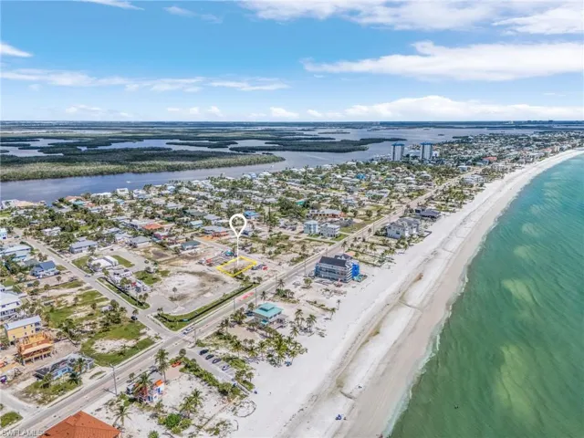 Drone / aerial view of waterfront with a beach