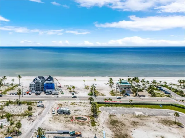 Drone / aerial view of waterfront with a beach