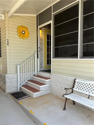 Entrance to property with a patio area