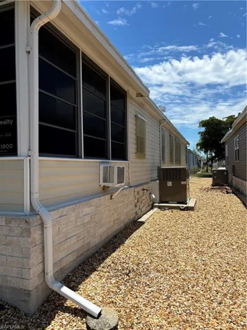 View of side of home featuring central air condition unit