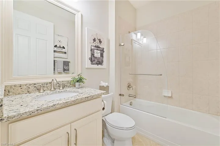 Full bathroom featuring vanity and shower / washtub combination