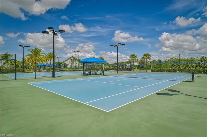 View of tennis court featuring community basketball court