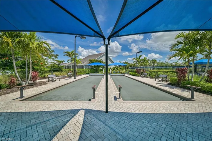 View of home's community with a bocce ball area