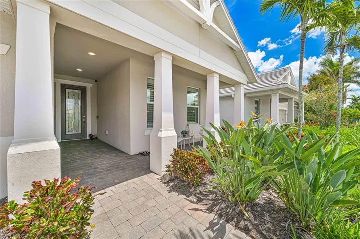 View of exterior entry featuring stucco siding