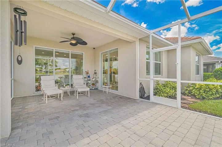 Sunroom with a ceiling fan