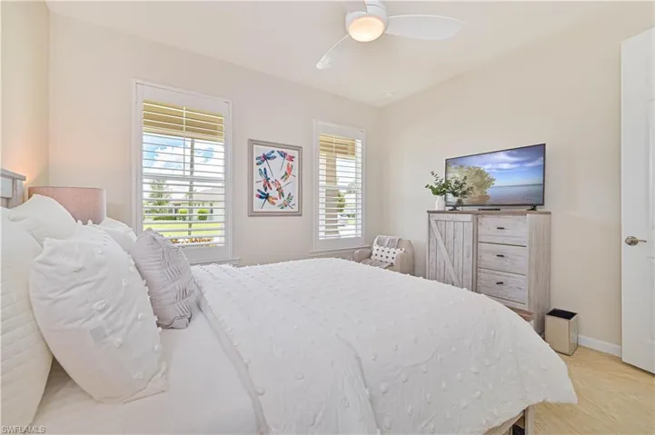 Bedroom with baseboards and ceiling fan
