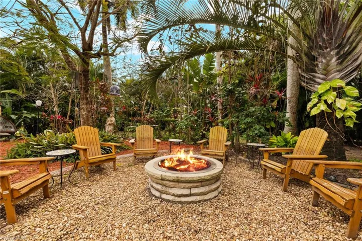 View of patio with an outdoor fire pit