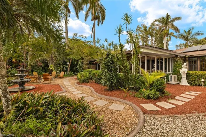 View of yard featuring a sunroom