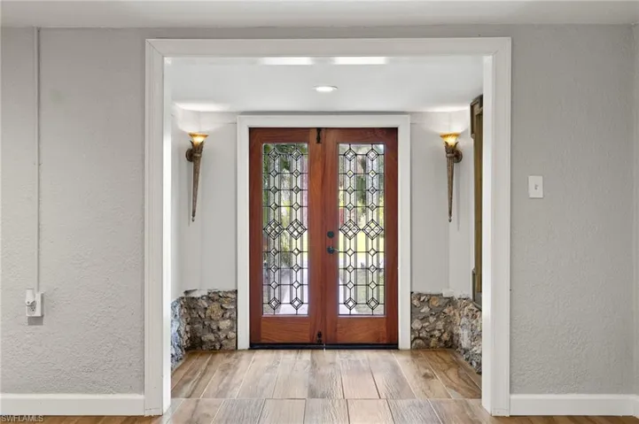 Foyer entrance featuring french doors