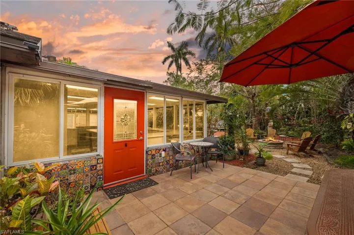 Patio terrace at dusk featuring a fire pit