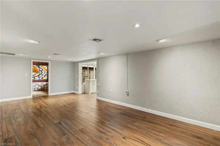 Empty room with wood-type flooring