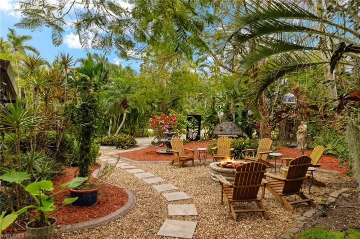 View of yard featuring a patio area and a fire pit