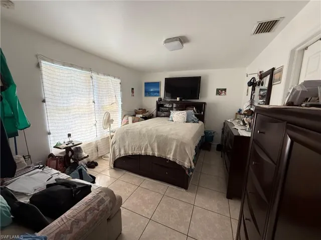 Bedroom featuring light tile patterned floors
