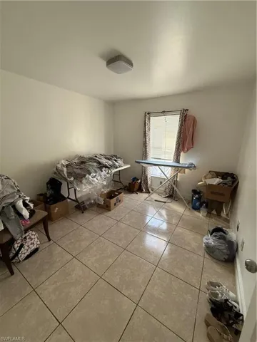 Miscellaneous room with light tile patterned floors