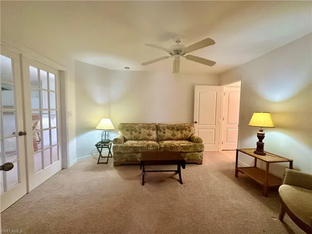 Den showing access to Jack & Jill Bathroom