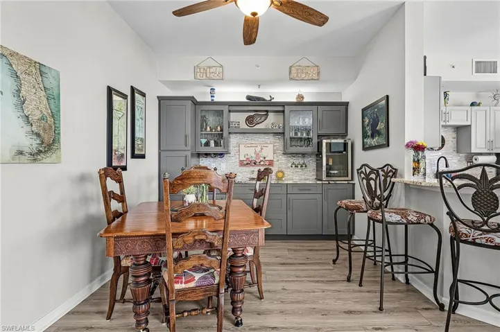 Dining area featuring built in cabinets with ceiling fan and vinyl finished floors