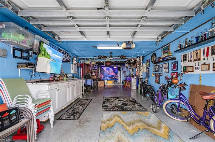 Garage with a garage door opener and utility sink