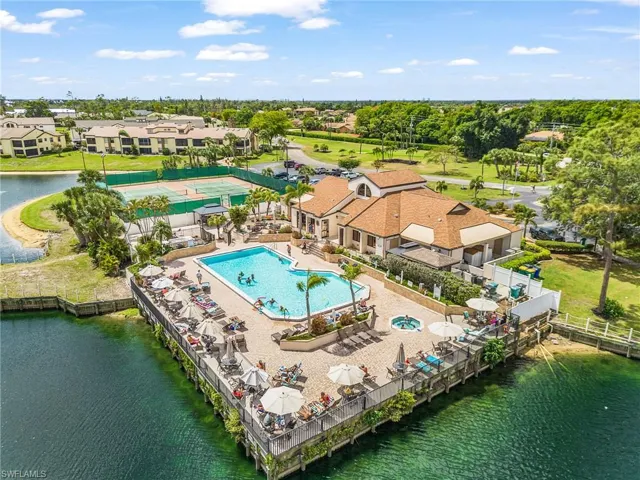 Drone / aerial view of clubhouse, hot tub and pool