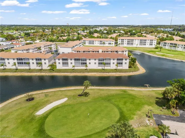 Aerial view of a local golf course and a nearby body of water