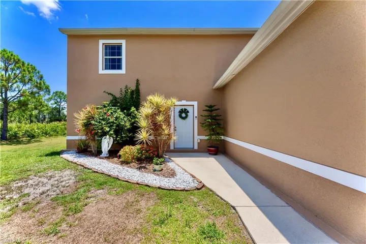 Property entrance featuring a lawn