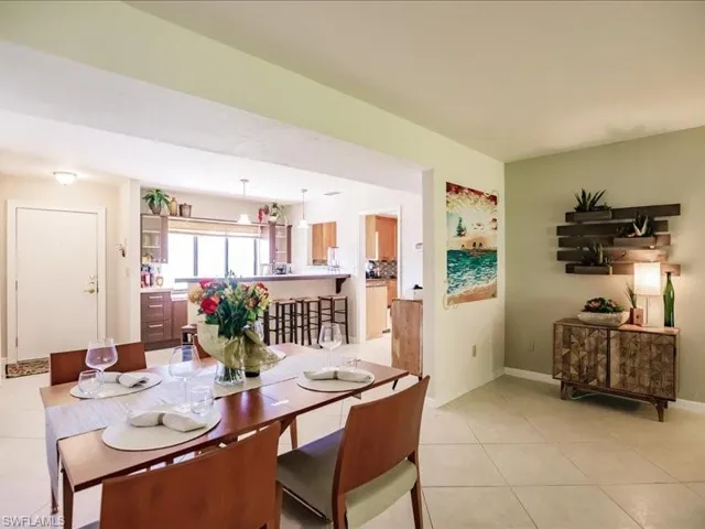 Dining area with light tile floors