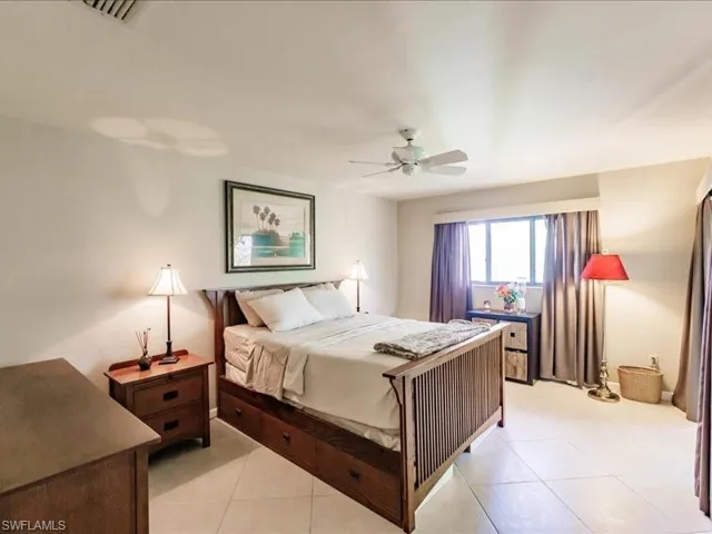 Tiled bedroom with ceiling fan