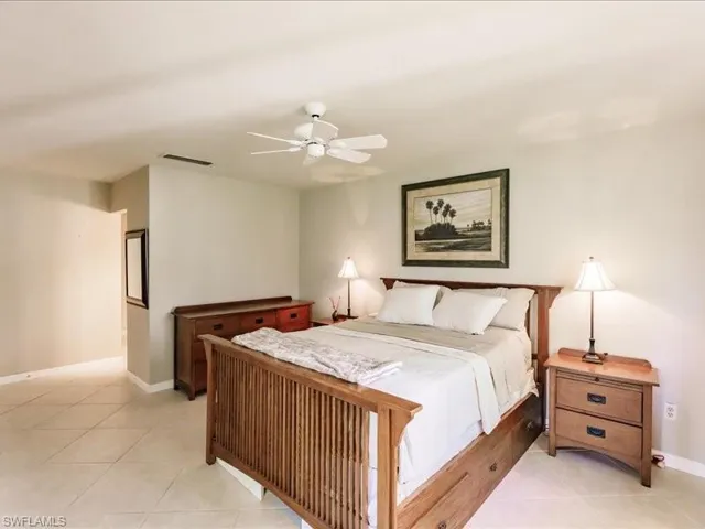 Bedroom featuring ceiling fan and tile floors