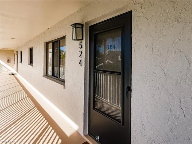 Entrance to property with a balcony