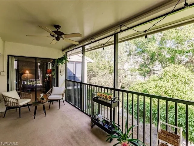 Sunroom / solarium featuring ceiling fan and a healthy amount of sunlight