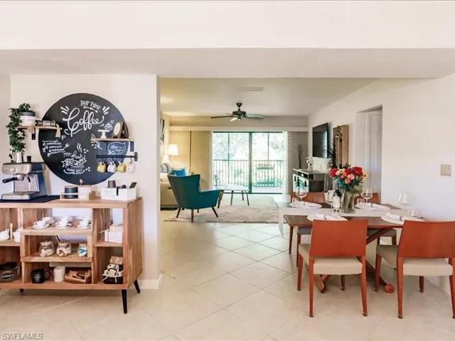 Dining room featuring ceiling fan and light tile floors