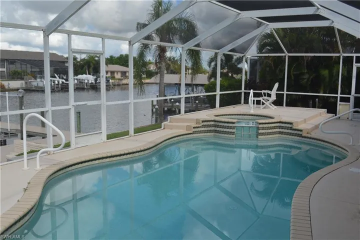 View of swimming pool with a water view