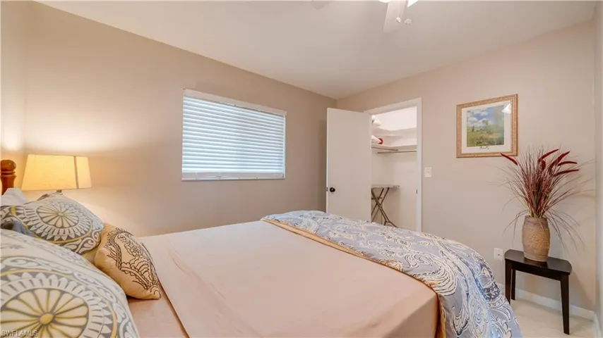Bedroom featuring a closet, ceiling fan, and a spacious closet