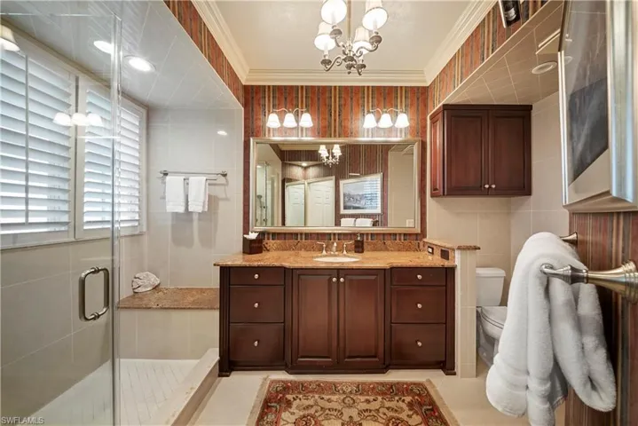 a large walk-in shower and a thoughtfully designed layout for comfort and convenience.