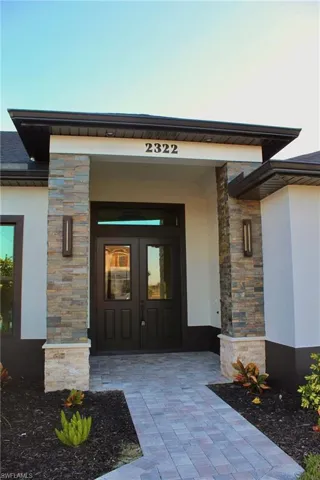 Property entrance with french doors and a porch