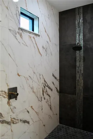 Bathroom with a tile shower