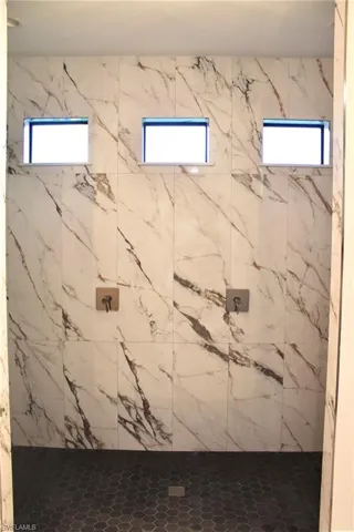 Bathroom featuring tiled shower