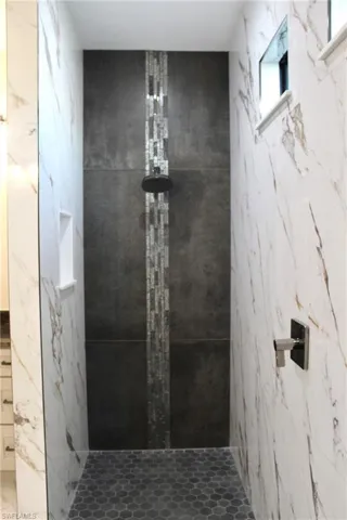 Bathroom with tiled shower