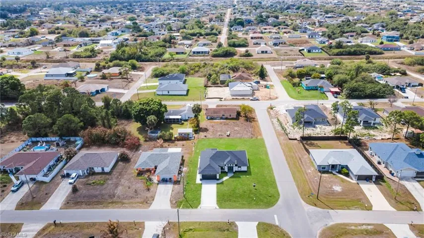 Aerial overview of property's location with nearby suburban area