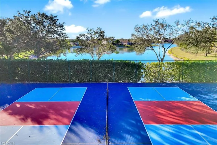 View of basketball court with a water view