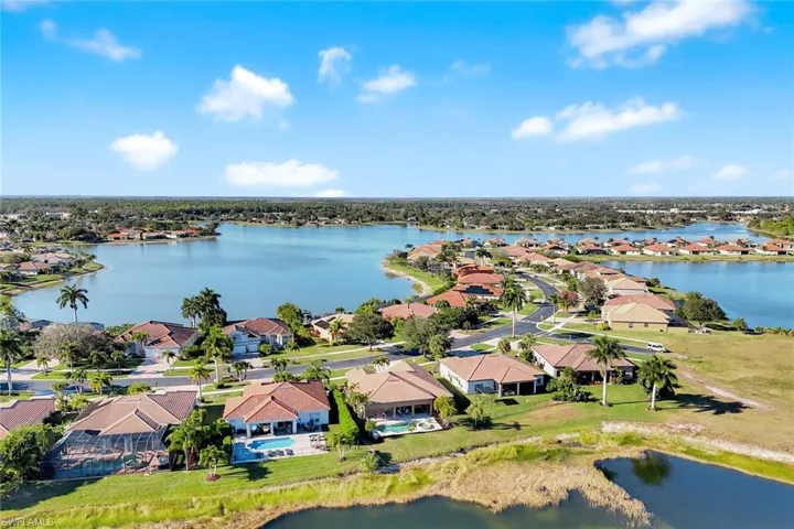 Aerial view of residential area featuring a large body of water